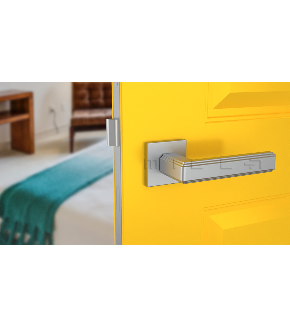 Satin chrome handle on yellow door