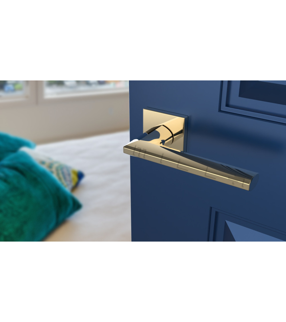 Gold door handle on a blue door