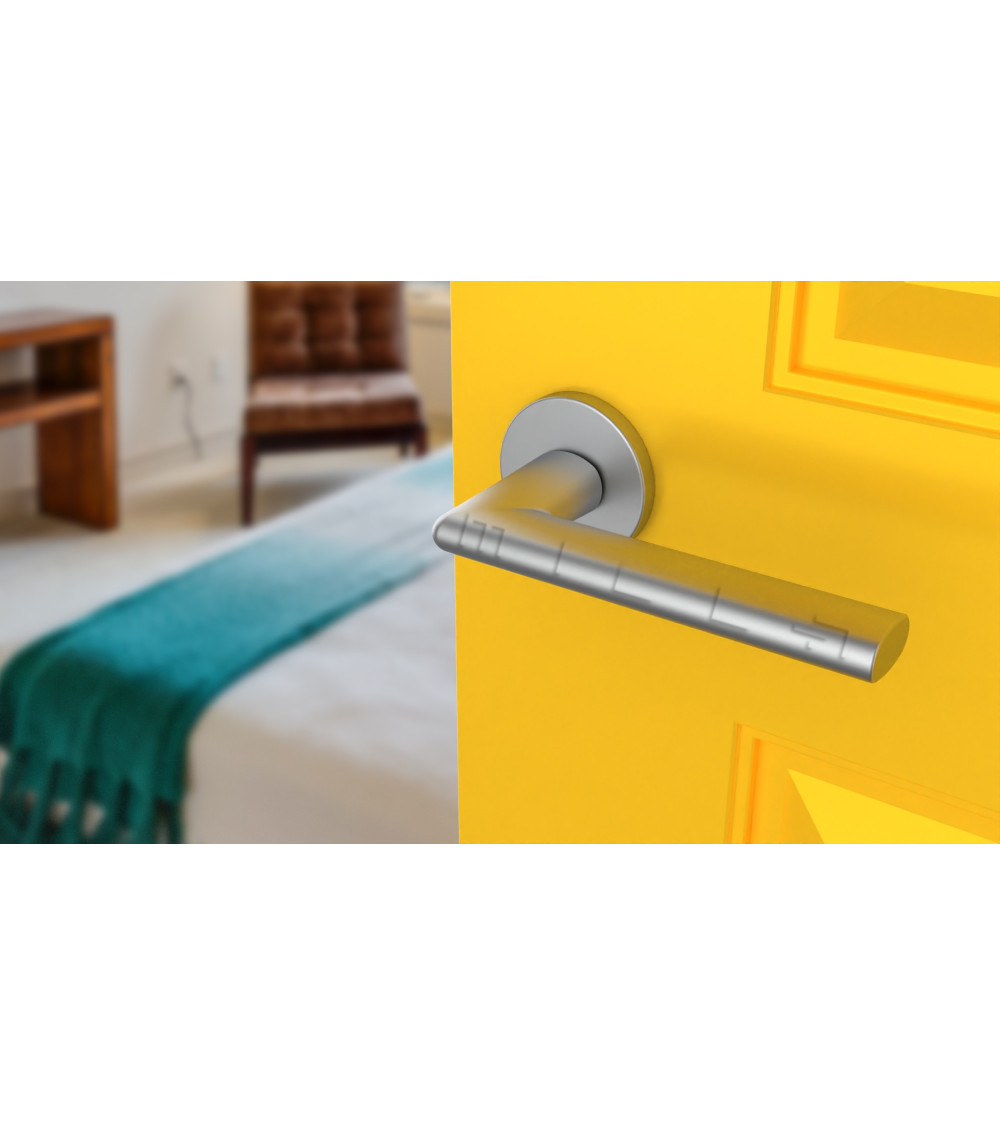 satin chrome handles on bright yellow door