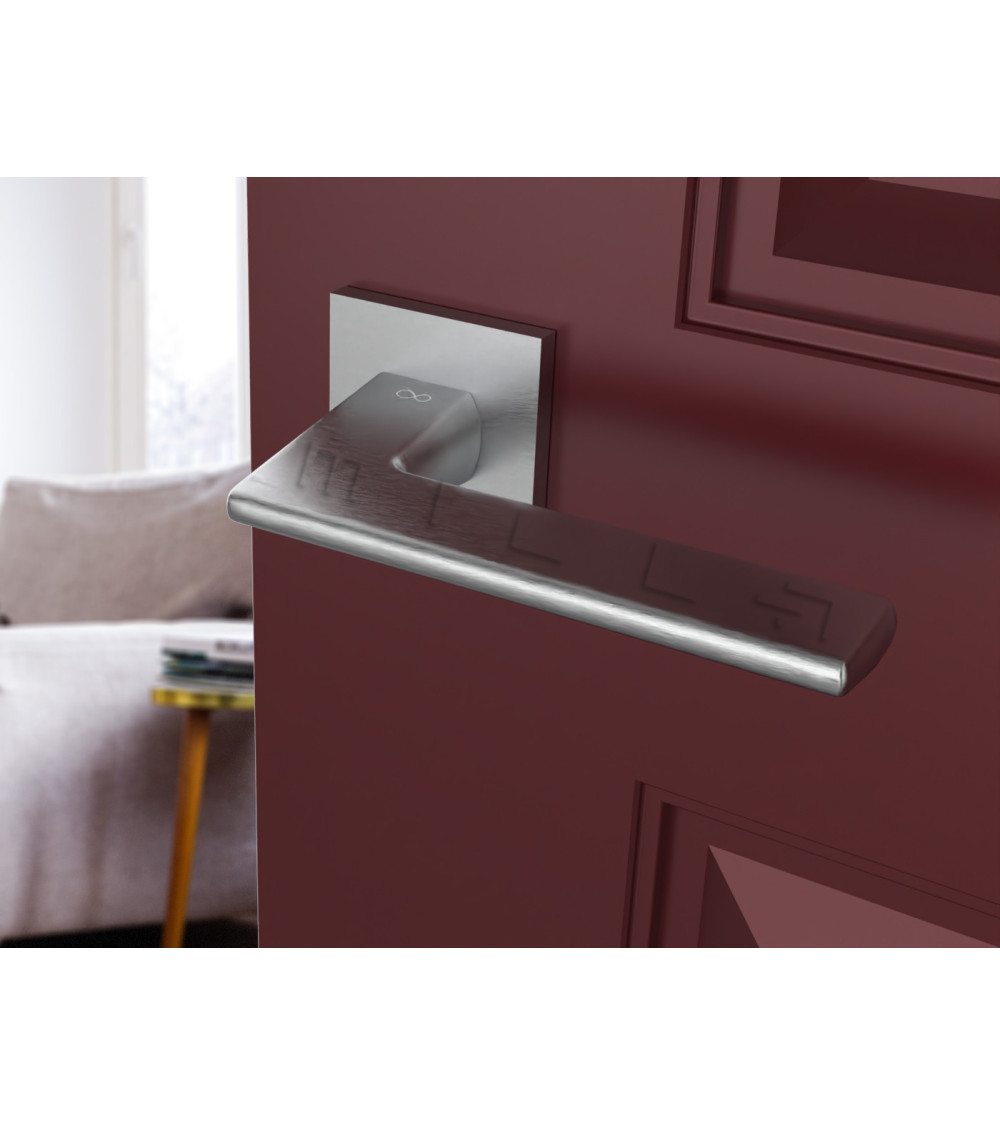 brushed chrome door handle on dark door