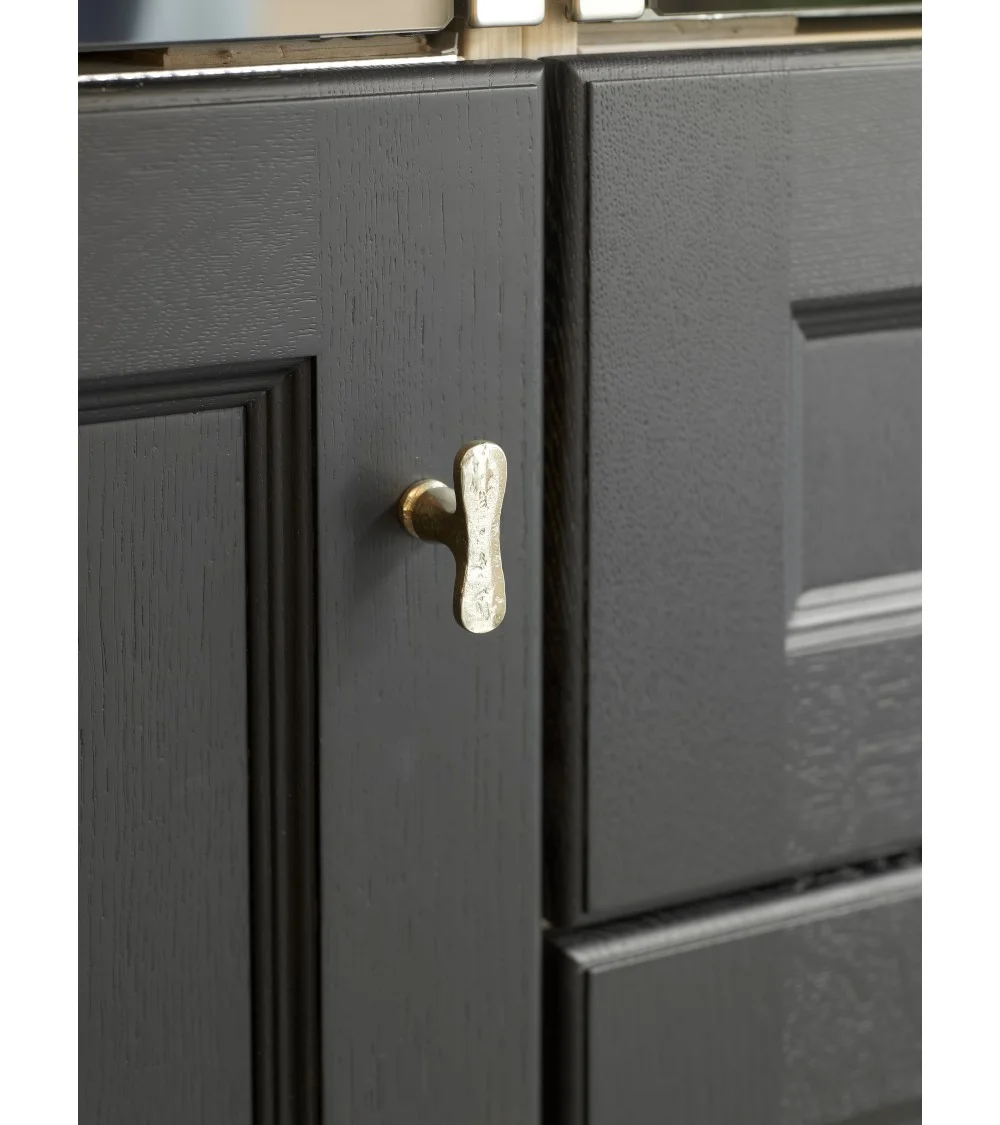 white bronze handle on black furniture
