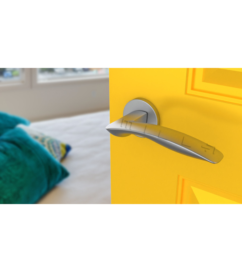 zamak door handle in polished chrome finish on yellow door